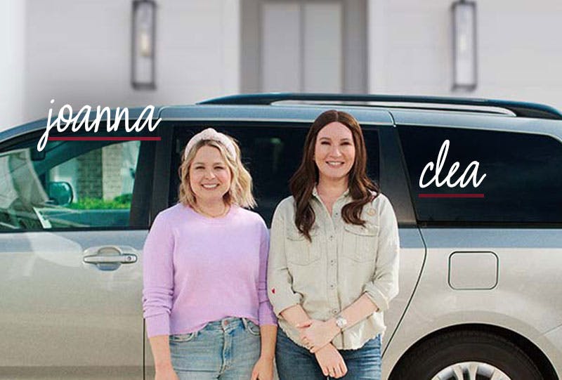 The Organizers standing in front of a minivan